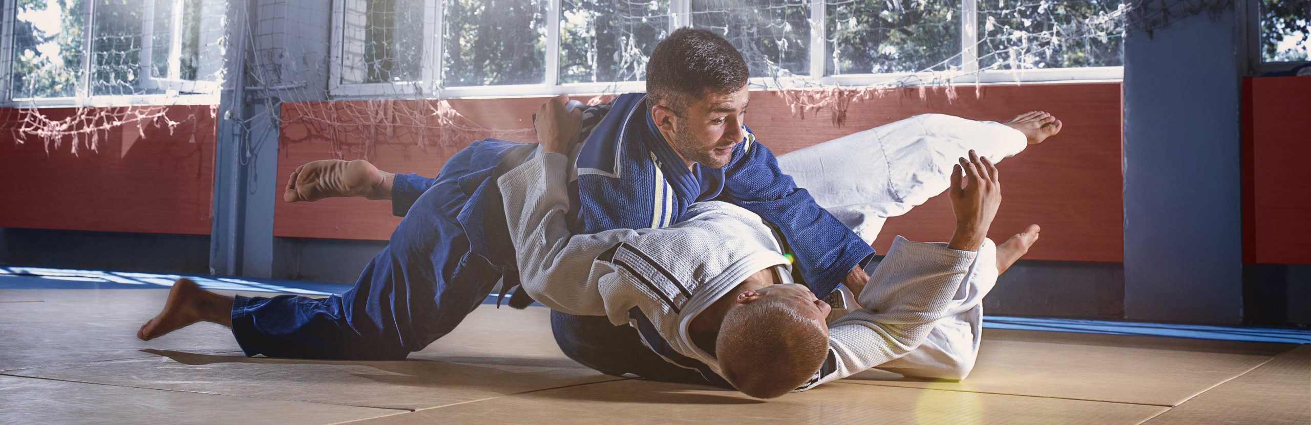 judo-fighters-showing-technical-skill-while-practicing-martial-arts-fight-club